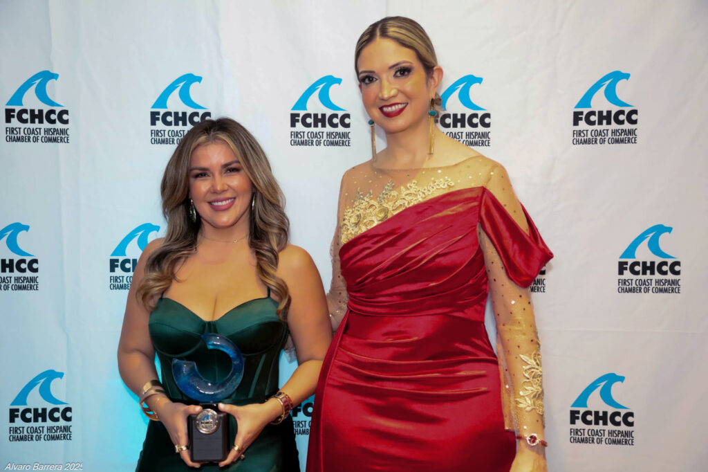 Daysi Jacobson holding her award at the First Coast Hispanic Chamber of Commerce event